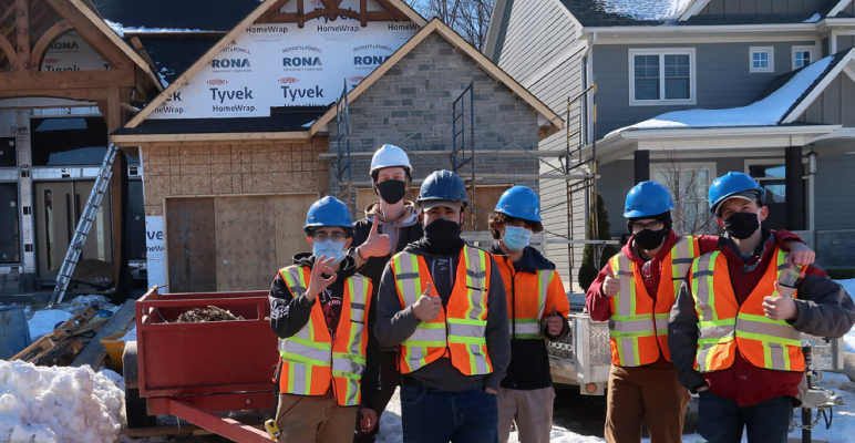 construction crew with vests and hardhats